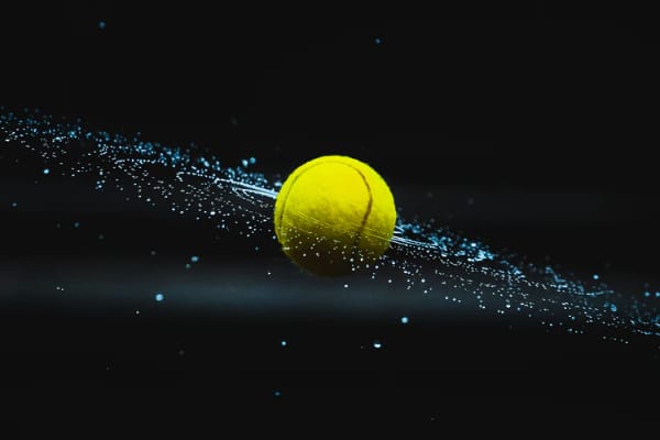 Free Amazing Sports Backgrounds for Designers: Tennis Ball in Black Background